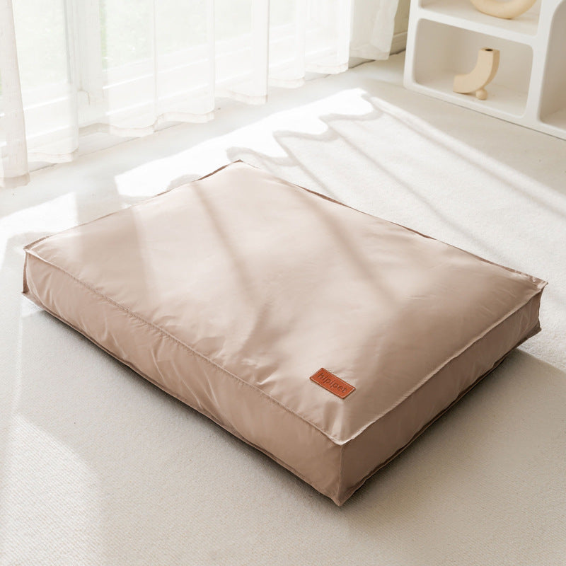 Durable waterproof pet bed for dogs and cats, orthopedic memory foam cushion with washable, water-resistant cover and non-slip base.